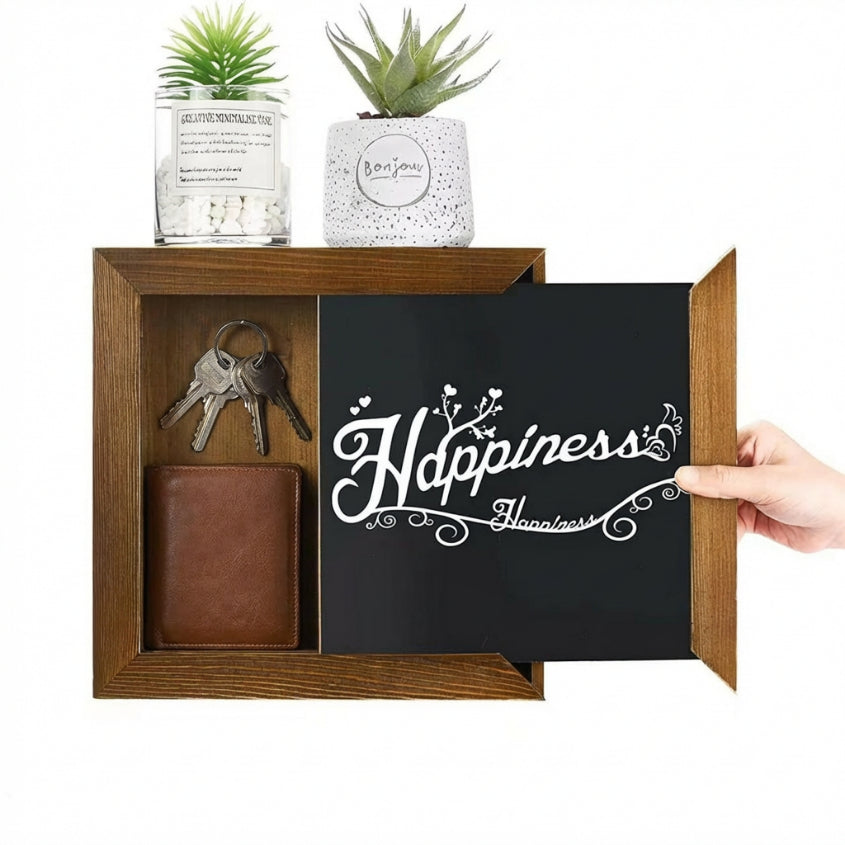 Wooden shelf with a wallet, keys, and small plants, featuring a blackboard with 'Happiness' text.