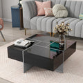 Modern living room with a gray sofa, black coffee table, and decorative items.