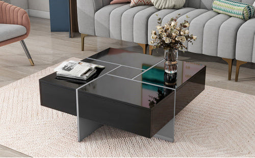 Modern black coffee table in a living room setting with a couch and decorative items.