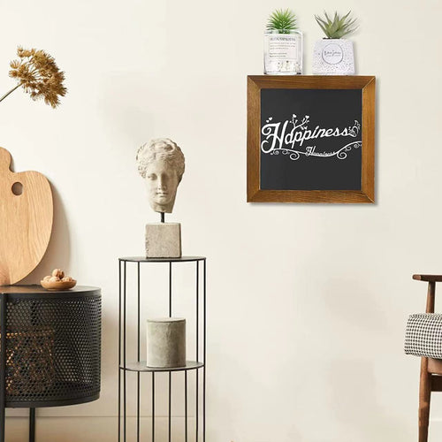 Decorative wall art with 'Happiness' on a blackboard in a home interior setting.
